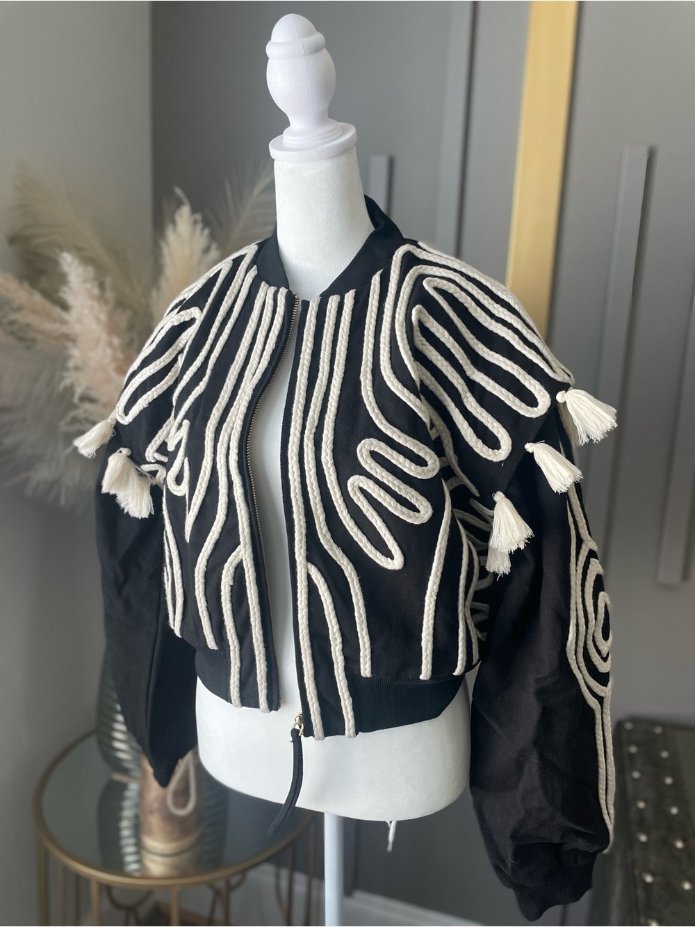 Cleobella Black Bomber Jacket with Cream Tassel Rope Trim.